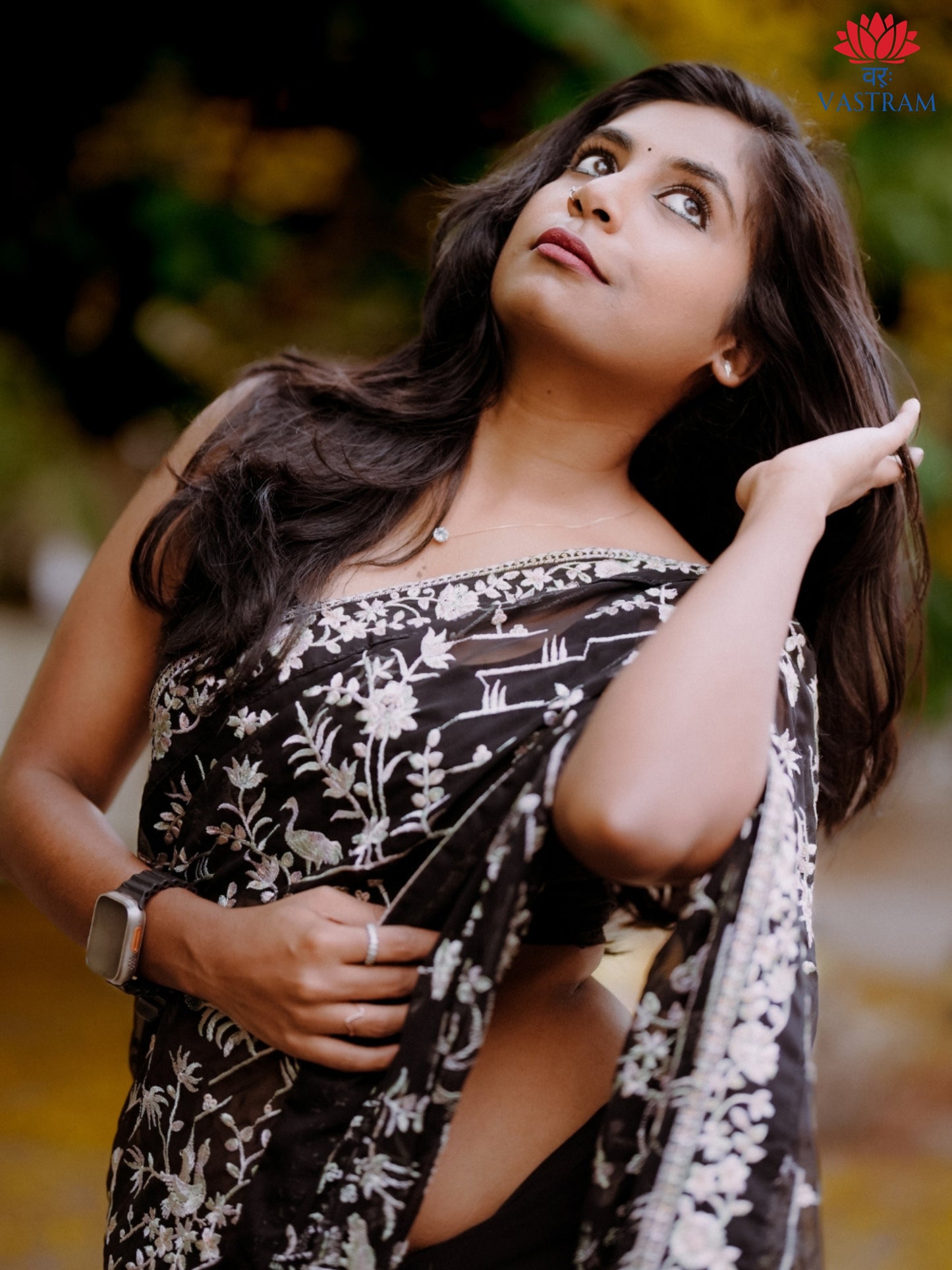 black georgette embroidered saree, bold party wear look, elegant evening drape with floral detailing