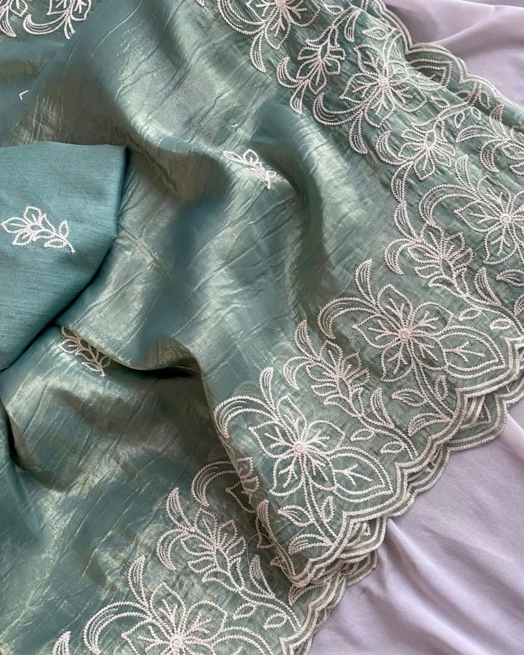 elegant green organza saree with intricate white floral embroidery – lightweight & festive wear