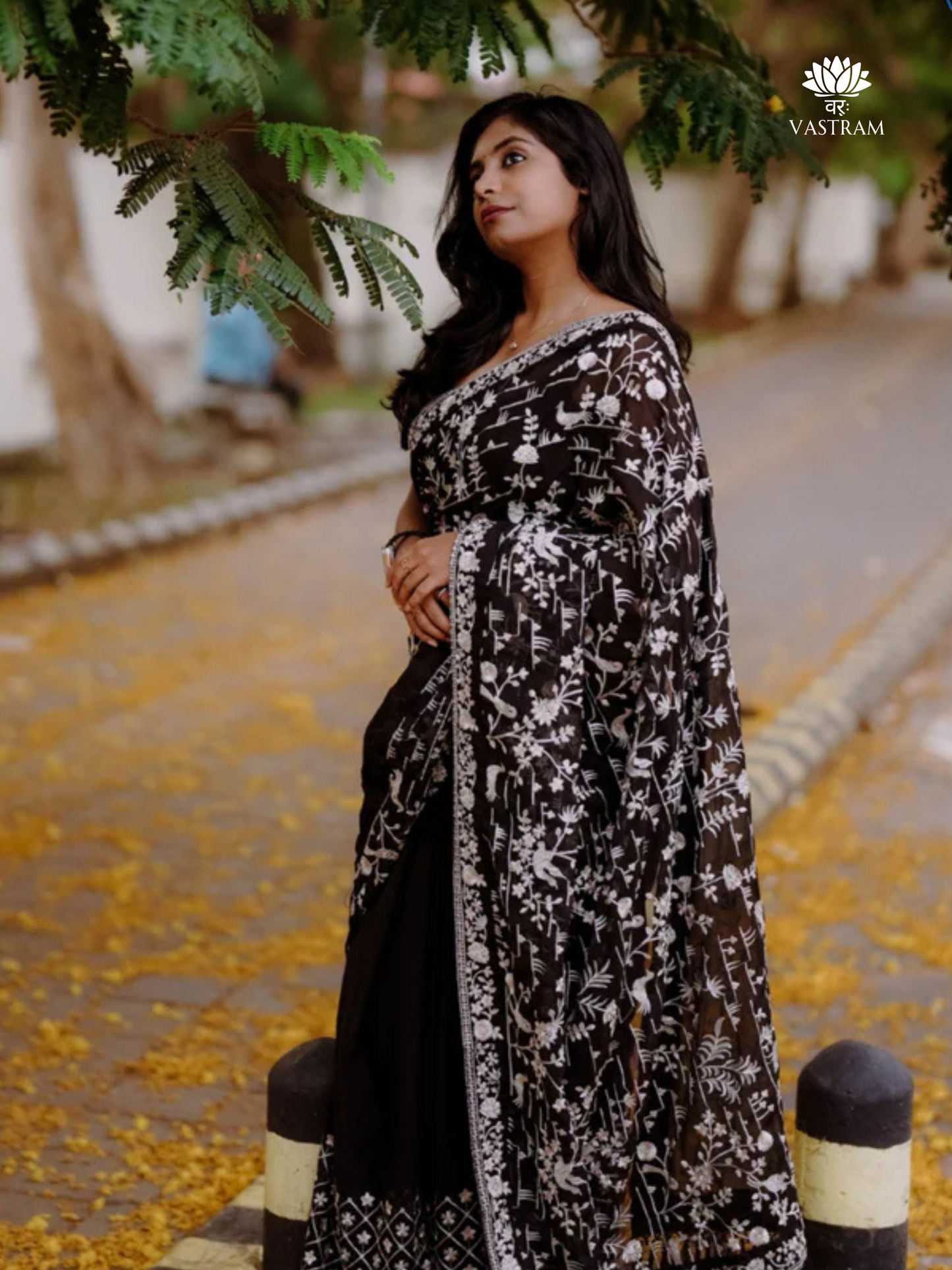black georgette embroidered saree, bold party wear look, elegant evening drape with floral detailing