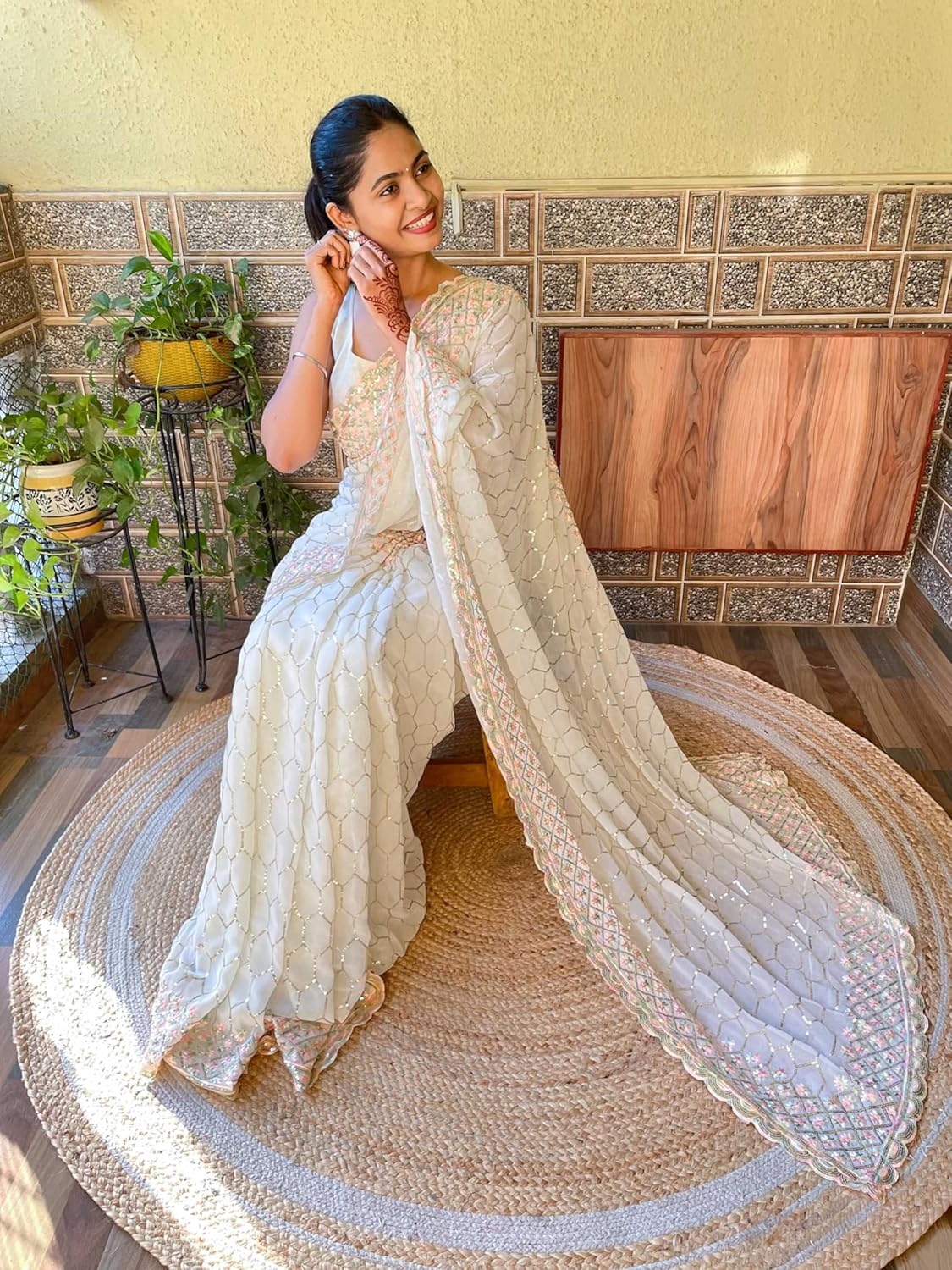 net saree with floral embroidery and golden sequin border – designer party & wedding wear