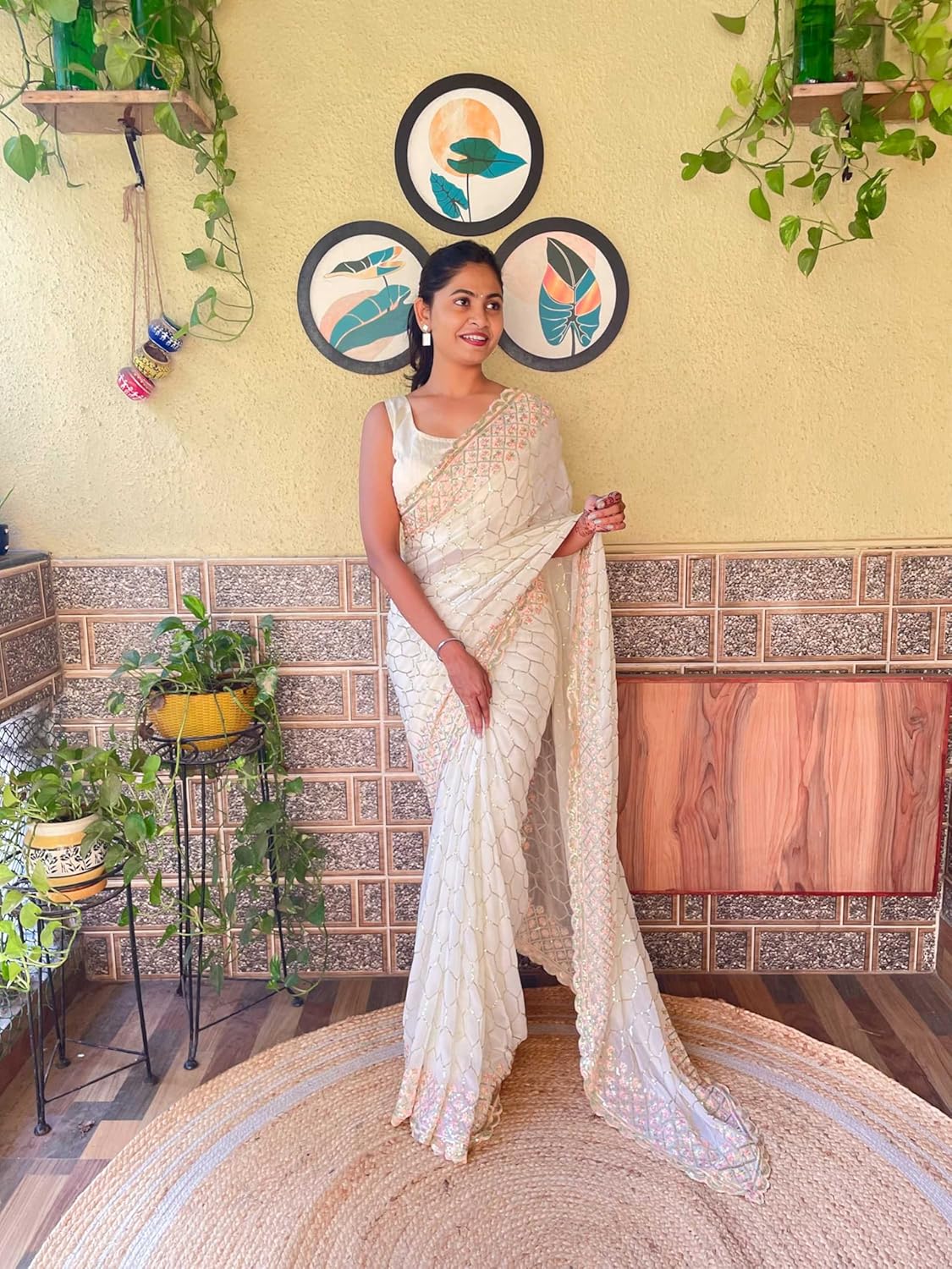 net saree with floral embroidery and golden sequin border – designer party & wedding wear