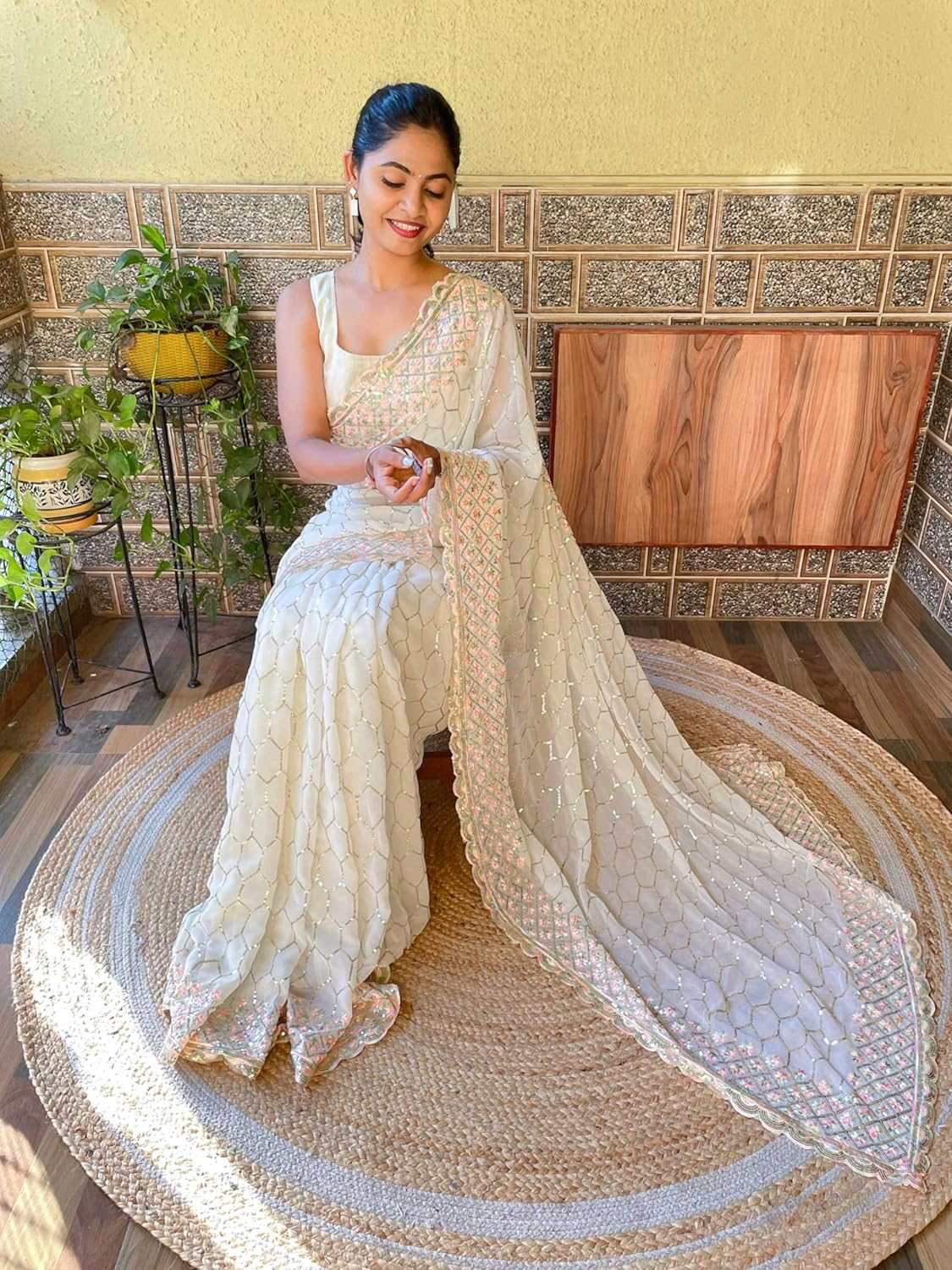 net saree with floral embroidery and golden sequin border – designer party & wedding wear